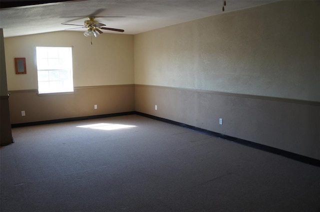 unfurnished room featuring carpet, ceiling fan, and lofted ceiling