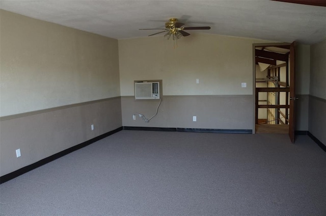 carpeted empty room with an AC wall unit and ceiling fan