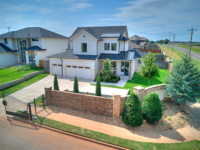 view of front of home with a front lawn and a garage