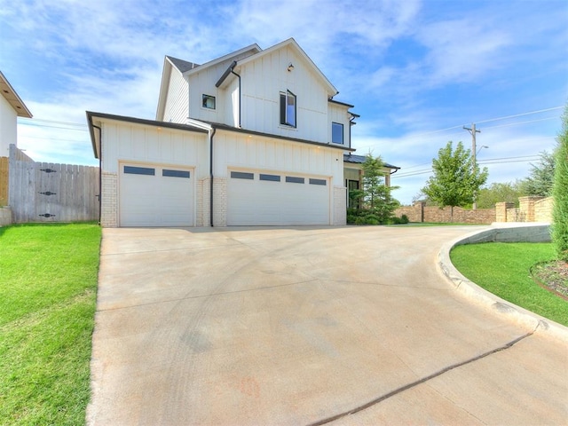 view of front facade with a garage and a front lawn