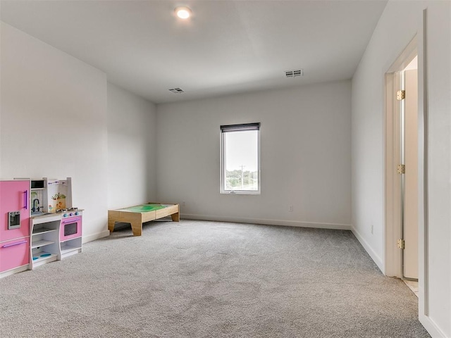 rec room featuring carpet flooring