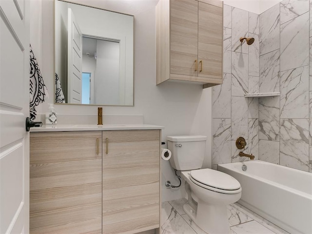 full bathroom featuring vanity, toilet, and tiled shower / bath