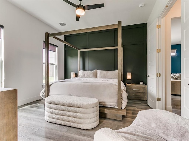 bedroom featuring hardwood / wood-style floors and ceiling fan