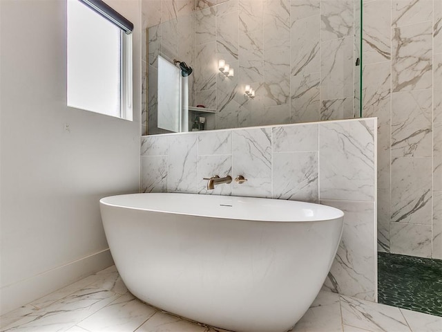 bathroom featuring separate shower and tub and tile walls