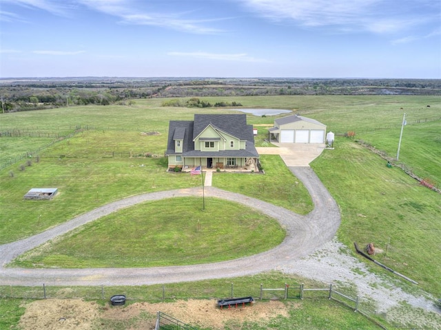 birds eye view of property with a rural view