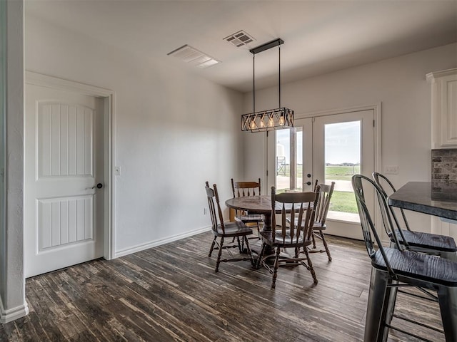 dining area featuring french doors and dark hardwood / wood-style floors