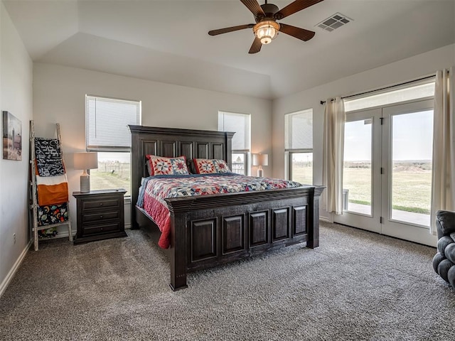 bedroom with ceiling fan, dark carpet, access to outside, and vaulted ceiling