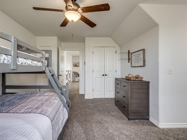 carpeted bedroom featuring ceiling fan, a closet, and lofted ceiling