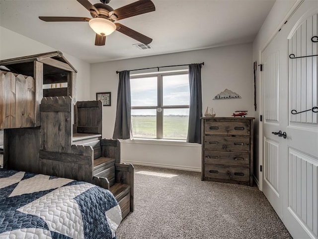 carpeted bedroom featuring ceiling fan