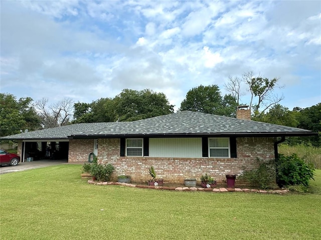 ranch-style home featuring a front yard and a carport