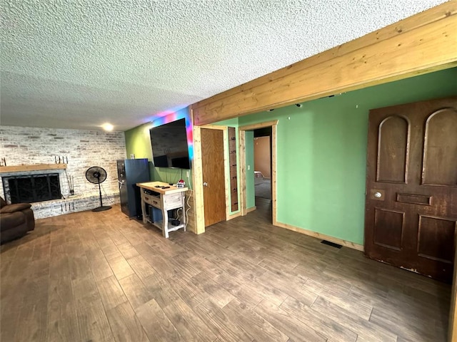 living room featuring hardwood / wood-style floors and a textured ceiling