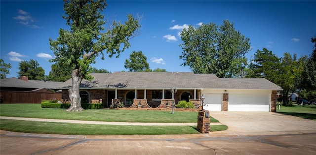 single story home featuring a front yard and a garage