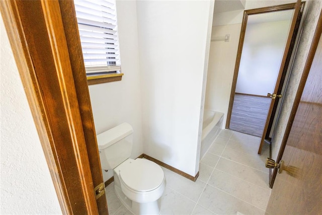 bathroom with tile patterned floors and toilet