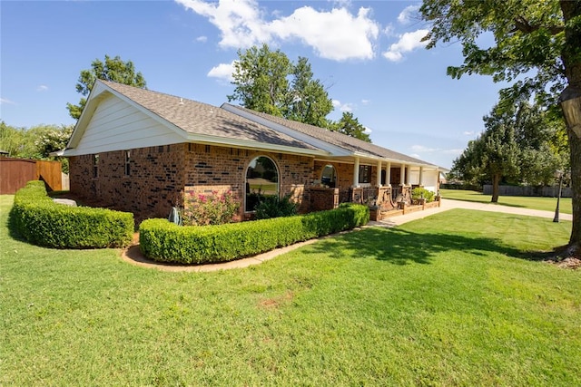 ranch-style house featuring a front lawn