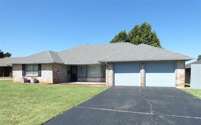 single story home with a garage and a front yard