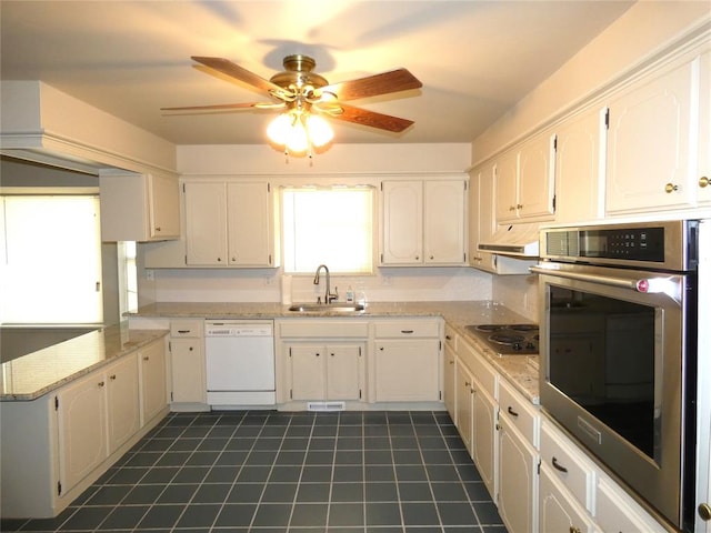 kitchen with exhaust hood, white cabinets, sink, ceiling fan, and stainless steel appliances