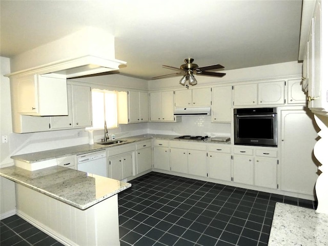 kitchen featuring white cabinetry, sink, light stone counters, kitchen peninsula, and appliances with stainless steel finishes