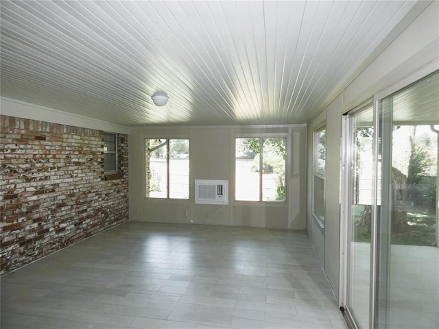 unfurnished sunroom featuring wooden ceiling