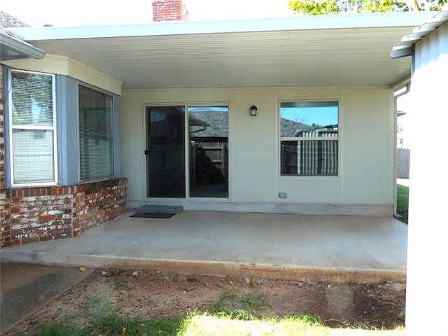 property entrance with a patio