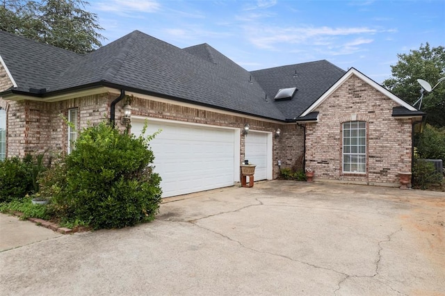 view of side of home with a garage