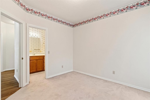 empty room featuring light carpet