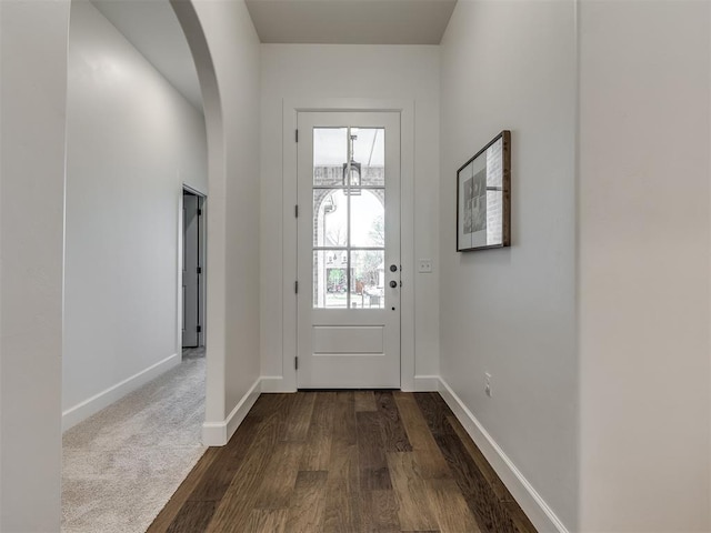 doorway to outside with dark hardwood / wood-style floors