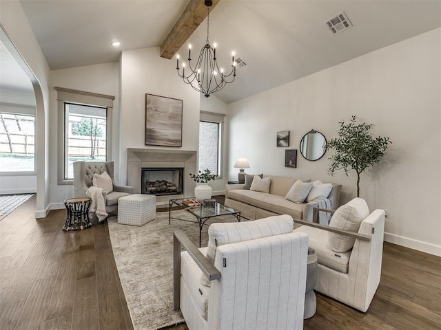 living room featuring a notable chandelier, vaulted ceiling with beams, and dark hardwood / wood-style floors