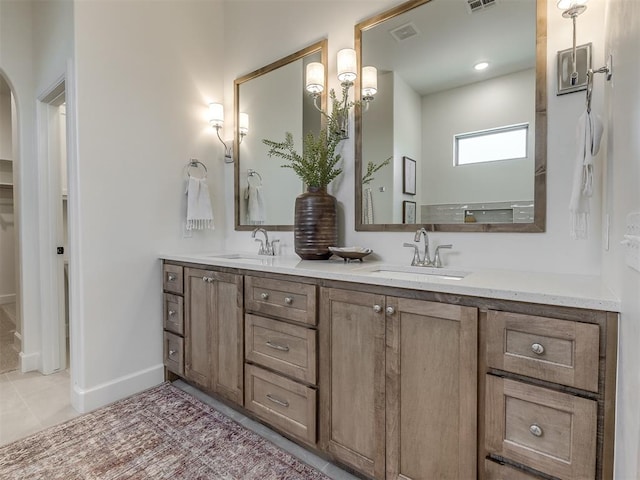 bathroom with tile patterned floors and vanity