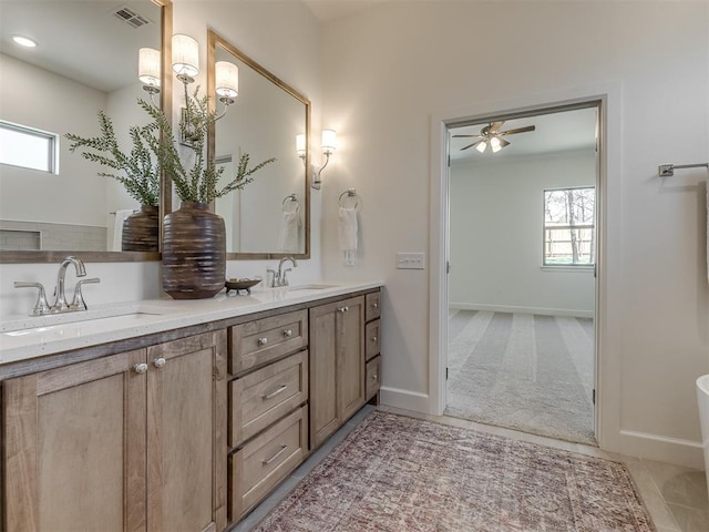 bathroom with vanity and ceiling fan