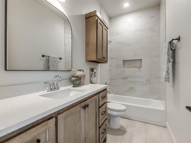 full bathroom with tile patterned flooring, vanity, toilet, and tiled shower / bath