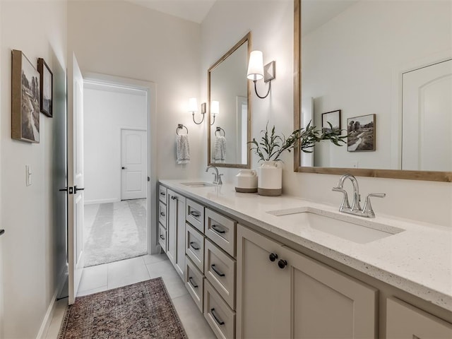 bathroom with tile patterned flooring and vanity