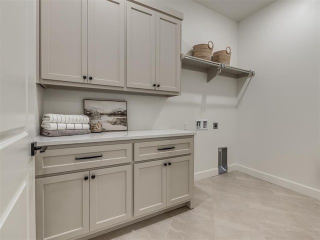 laundry room with hookup for an electric dryer, cabinets, and hookup for a washing machine