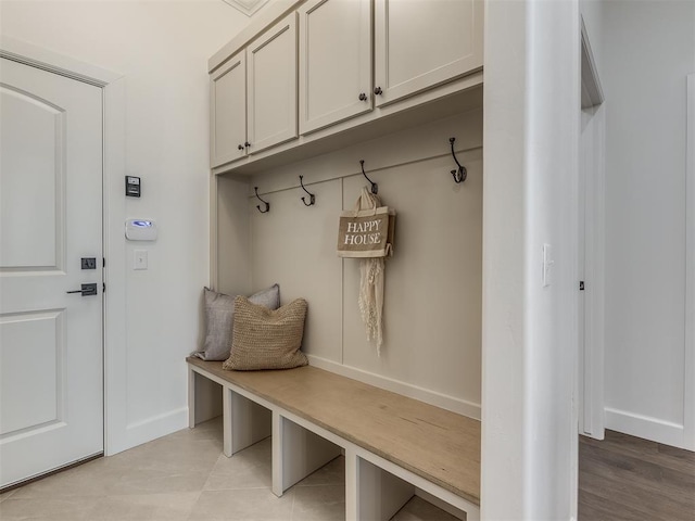 mudroom with light hardwood / wood-style flooring