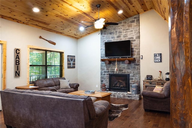 living room with dark hardwood / wood-style flooring, ceiling fan, high vaulted ceiling, wooden ceiling, and a fireplace