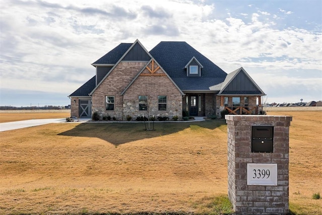 craftsman-style house with a front yard