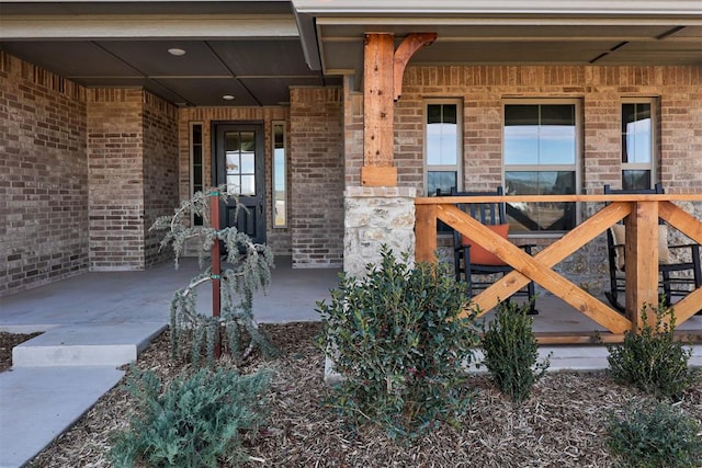 doorway to property featuring a porch