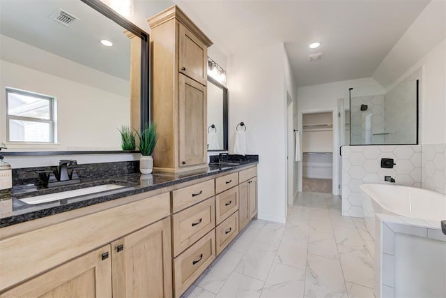 bathroom featuring vanity and separate shower and tub