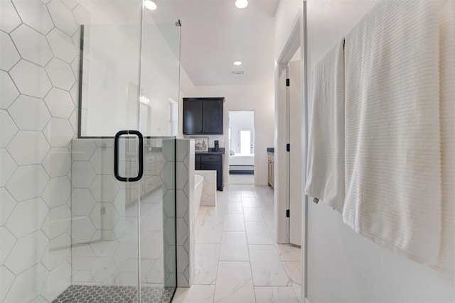 bathroom with a shower with shower door and a baseboard heating unit