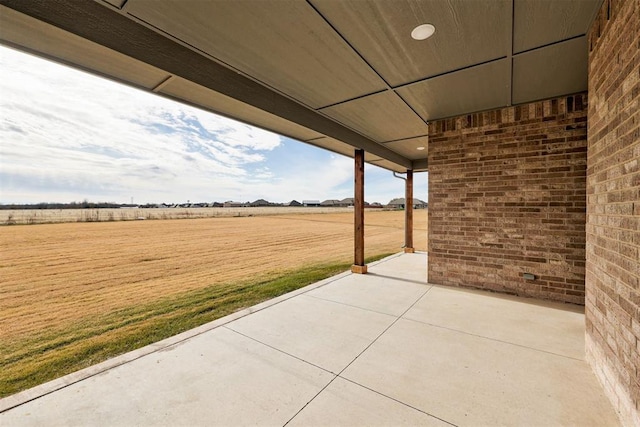 view of patio with a rural view