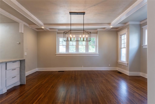 unfurnished dining area with beamed ceiling, dark hardwood / wood-style floors, and an inviting chandelier