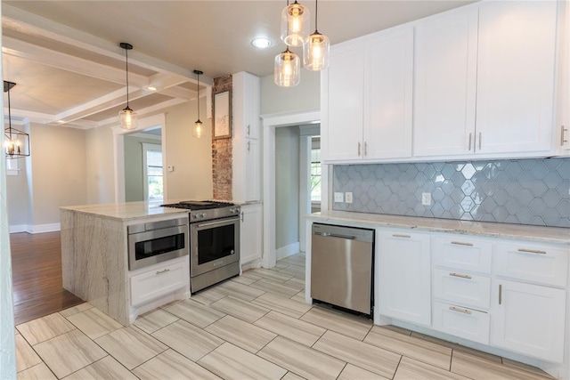 kitchen featuring beamed ceiling, appliances with stainless steel finishes, decorative light fixtures, and white cabinetry