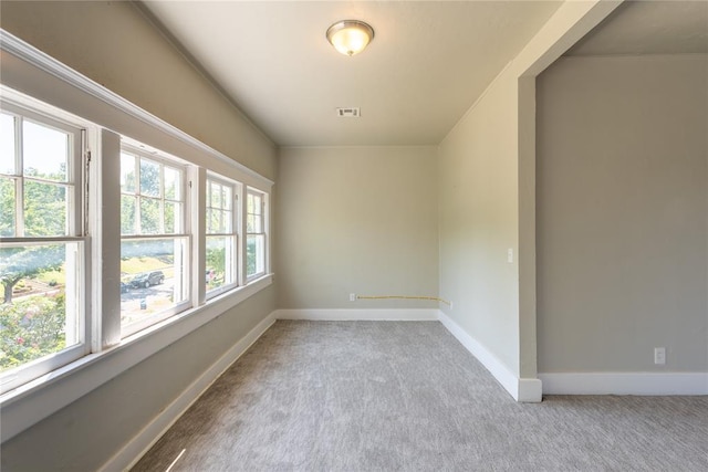 spare room with light colored carpet