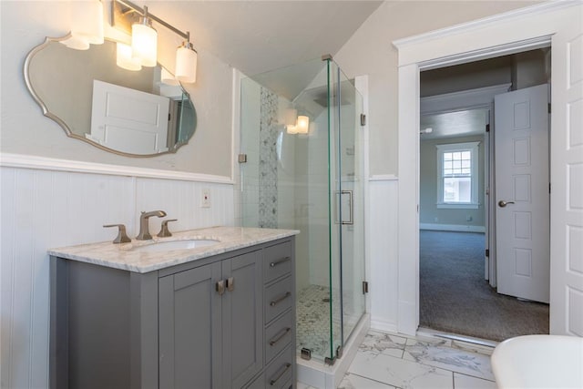 bathroom featuring vanity, wooden walls, walk in shower, and lofted ceiling