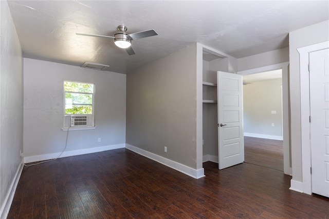 interior space with ceiling fan, dark hardwood / wood-style flooring, and cooling unit