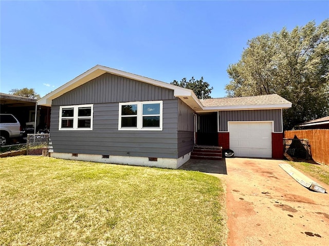 view of front of house featuring a garage and a front yard