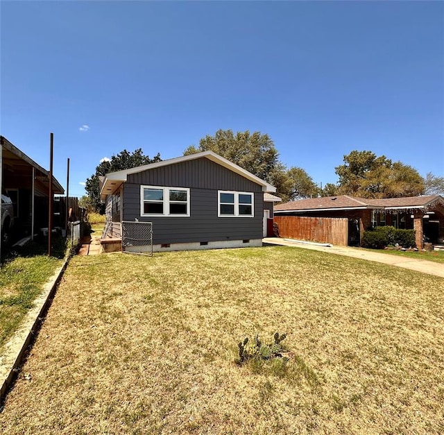 back of house with a yard