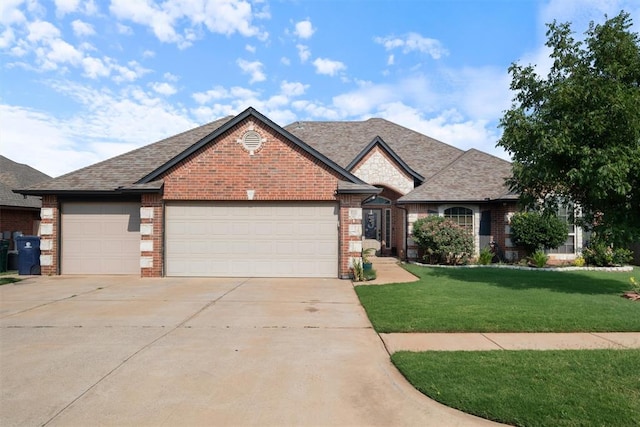 view of front of property featuring a garage and a front yard