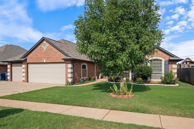 view of front of house with a garage and a front lawn