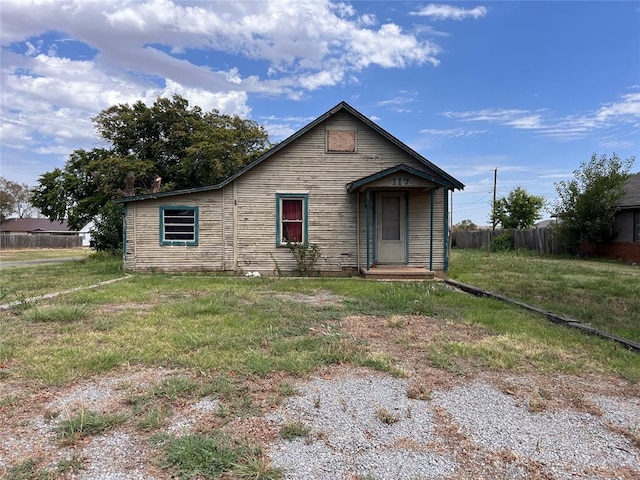 bungalow with a front lawn