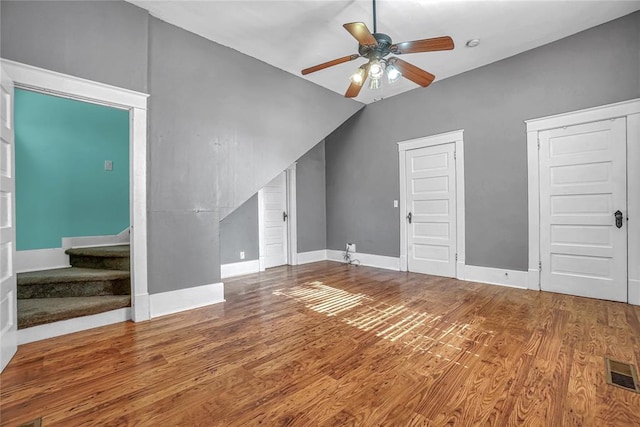 additional living space featuring hardwood / wood-style flooring, ceiling fan, and lofted ceiling